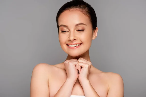 Happy beautiful naked woman with perfect skin looking down isolated on grey — Stock Photo