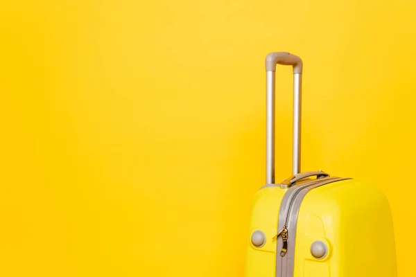 Colorful travel bag on yellow background — Stock Photo