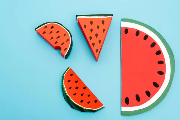 Top view of paper watermelon slices on blue background — Stock Photo