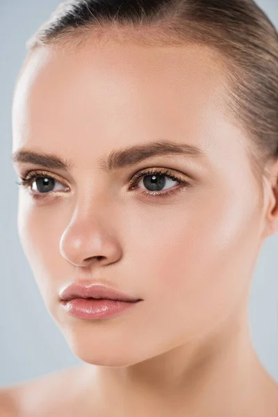 Close up of attractive girl looking away isolated on grey — Stock Photo