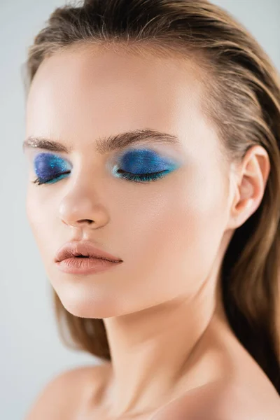 Close up of naked young woman with makeup and closed eyes isolated on white — Stock Photo