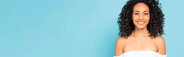 Panoramic concept of happy african american girl isolated on blue — Stock Photo