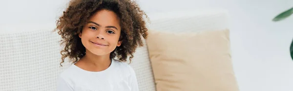 Horizontal image of curly african american child looking at camera — Stock Photo