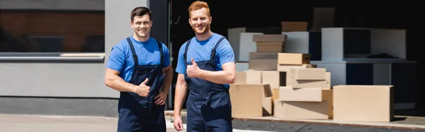 Panoramic crop of movers showing like gesture at camera on urban street — Stock Photo