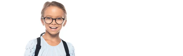 Panoramic shot of excited schoolgirl in glasses looking at camera isolated on white — Stock Photo