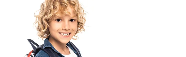 Panoramic shot of curly blonde schoolkid looking at camera isolated on white — Stock Photo