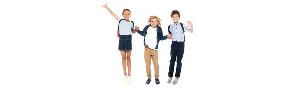 Concept panoramique d'écoliers bouclés tenant la main avec une écolière et sautant isolé sur blanc — Photo de stock