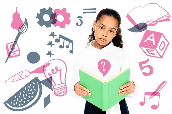 Upset african american schoolgirl looking at camera while holding book isolated on white, educational illustration — Stock Photo