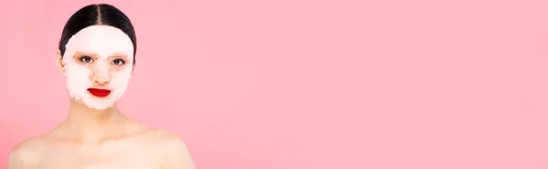 Website header of naked asian woman in face mask looking at camera isolated on pink — Stock Photo