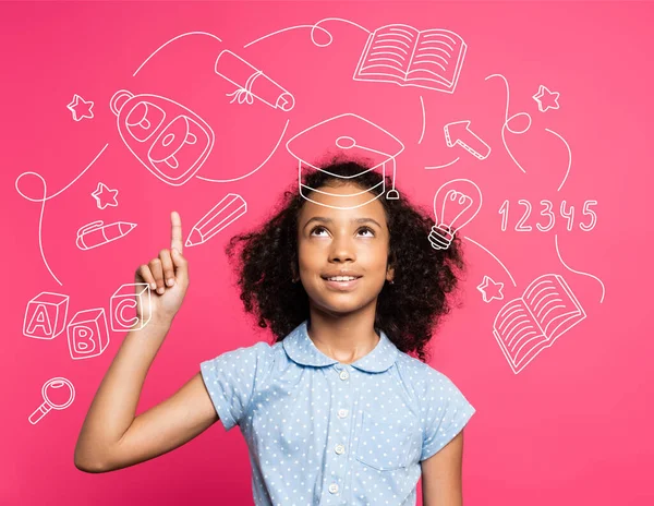 Curly african american kid pointing with finger and looking up near illustration on pink — Stock Photo