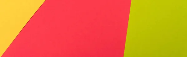 Vista superior de colorido abstracto amarillo, rojo, fondo de papel verde, plano panorámico - foto de stock