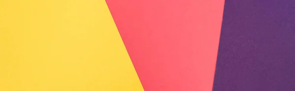 Top view of colorful abstract yellow, purple and pink paper background, panoramic shot — Stock Photo