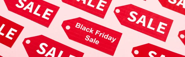 Website header of labels with sale and black friday lettering on pink — Stock Photo