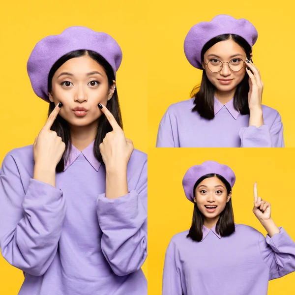 Joven mujer asiática en boina tocando mejillas, sonriendo y señalando con el dedo aislado en amarillo - foto de stock