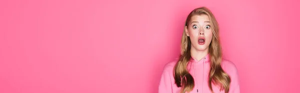 Shocked beautiful woman with open mouth on pink background, banner — Stock Photo