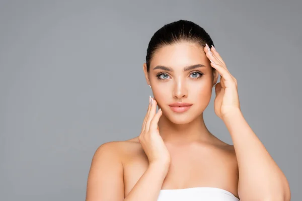 Beautiful woman posing isolated on grey — Stock Photo