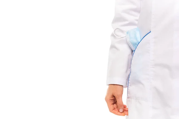 Cropped view of doctor in white coat with medical mask in pocket isolated on white — Stock Photo