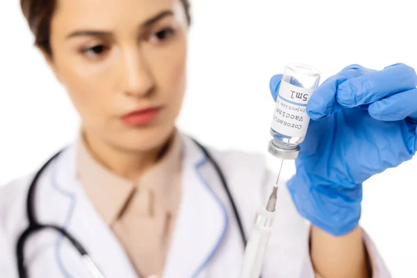 Selective focus of doctor picking up coronavirus vaccine in syringe isolated on white — Stock Photo