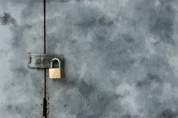 Old keys on painted wooden doors.