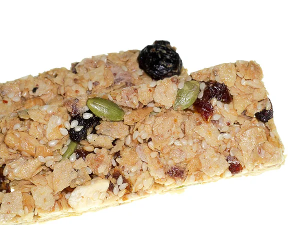 Close up Mixture of grains and fruits cereal bar on white background.