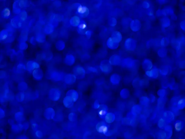輝くディープ ブルーの背景のボケ味 — ストック写真