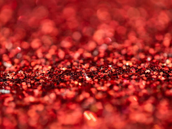 Red Sparkling Glitter bokeh Background.