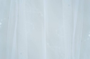 Hassas beyaz düğün elbise arka plan yumuşak odak kadar kapatın.