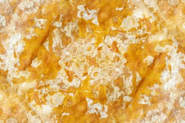 Sarı taş arka planını dokulu yakın çekim.