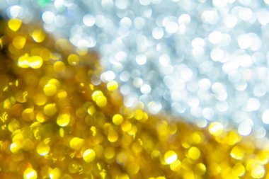 Gümüş ve altın parlak bokeh arka plan.