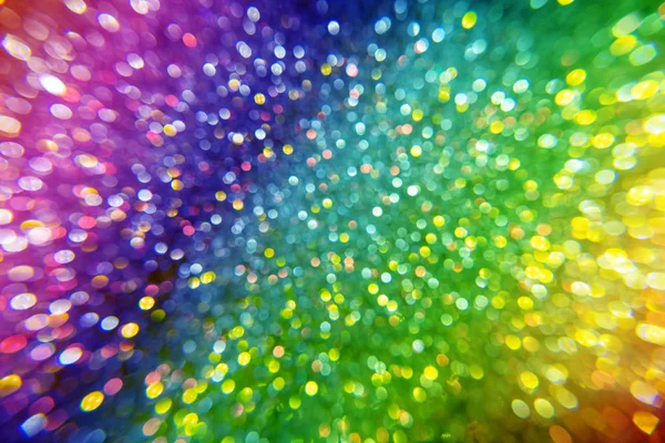 Multi color sparkling bokeh background with light.