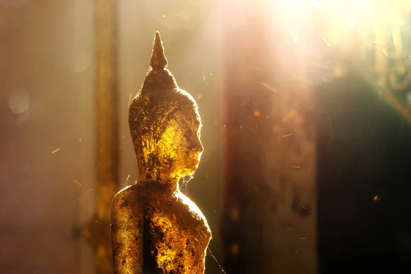 stock image Close up the buddha with light and floating dust at Wang Wiwekaram Temple, Sangkhla Buri district, Kanchanaburi. The travel in western of Thailand.