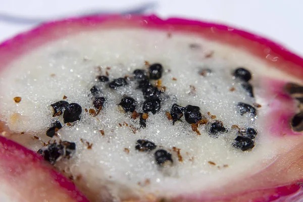 Close up black seeds of Peruvian Apple Cactus Fruit. (Scientific name Cereus repandus)