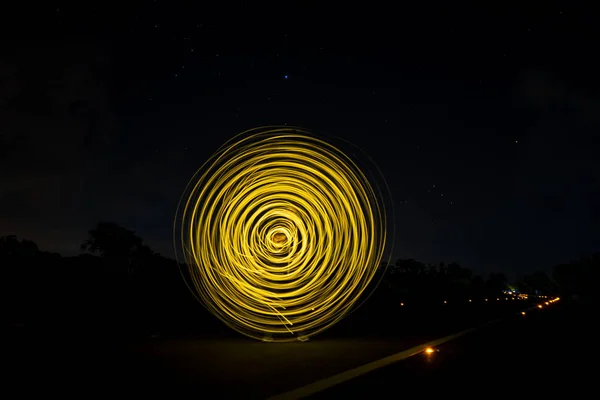 Motion of the light circle in the night on the road. — Stock Photo, Image