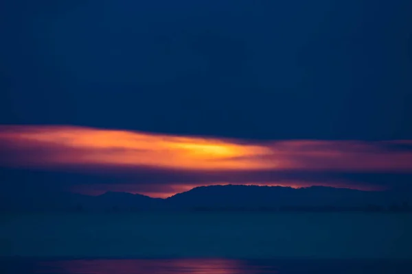 Seascape of sunset sky and rain clouds — Stock Photo, Image