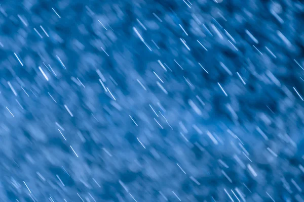 Abstrakter Regenfall und Bokeh-Hintergrund. — Stockfoto