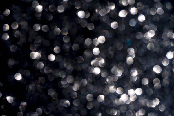 Jiskřivé glitter bokeh pozadí se světlem. — Stock fotografie