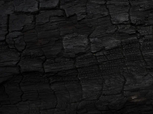 Povrch dřevěného uhlí na pozadí. — Stock fotografie