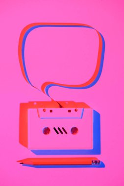 toned pink picture of pencil and retro audio cassette with speech bubble clipart