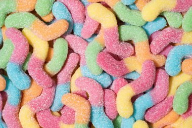 full frame shot of colorful gummy worms covered with sugar clipart