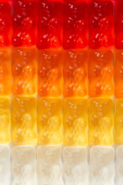 full frame shot of gummy bears in gradient clipart