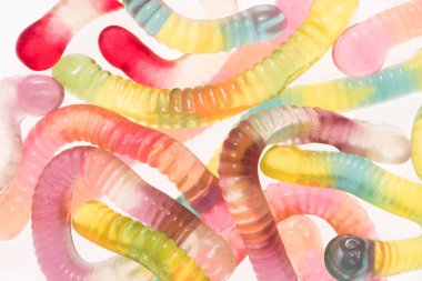 full frame shot of colorful gummy worms isolated on white clipart