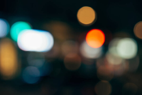close up view of colorful bokeh lights on dark background