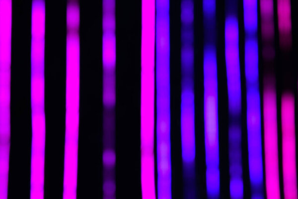 close up view of blurred black, pink and purple background
