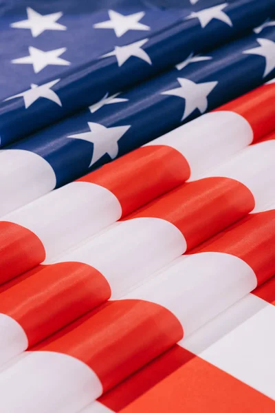 close up view of folded american flag background