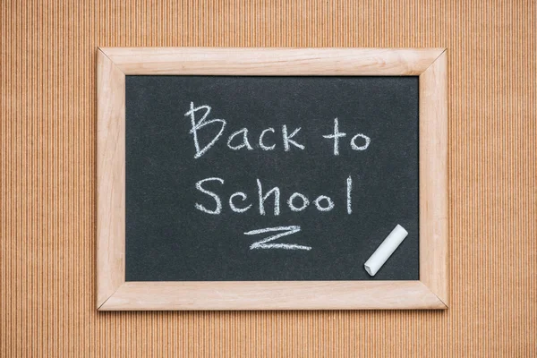 Top View Blackboard Back School Inscription Piece Chalk Brown Background — Stock Photo, Image