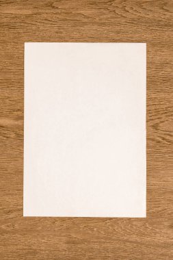 view from above of blank white paper on wooden table clipart