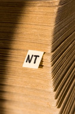 close up view of stack of cardboard papers and note with lettering nt  clipart