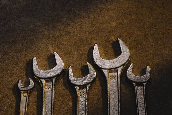 Top View Different Wrenches Brown Surface — Stock Photo, Image