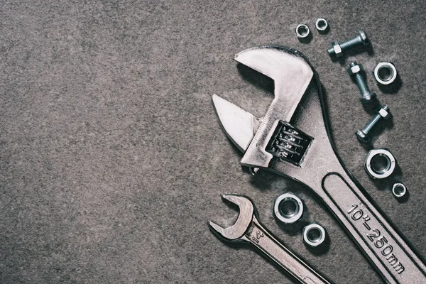 Top View Monkey Wrench Wrench Nuts Grey Surface — Stock Photo, Image