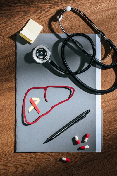 Top View Folder Pills Stethoscope Empty Stick Liver Ribbon Table — Stock Photo, Image